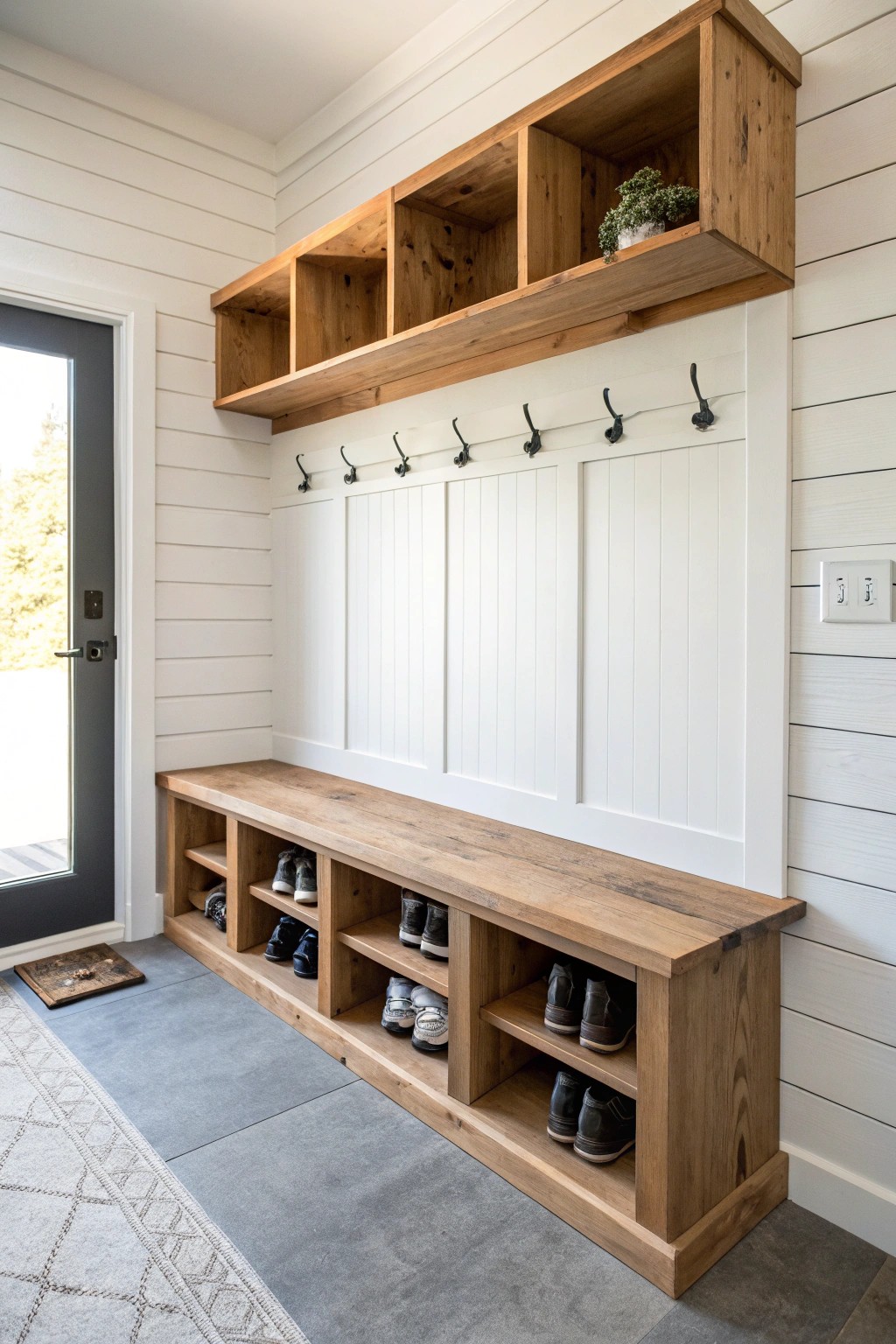 A beautifully crafted mudroom bench transforms your garage entry into a serene, organized space.