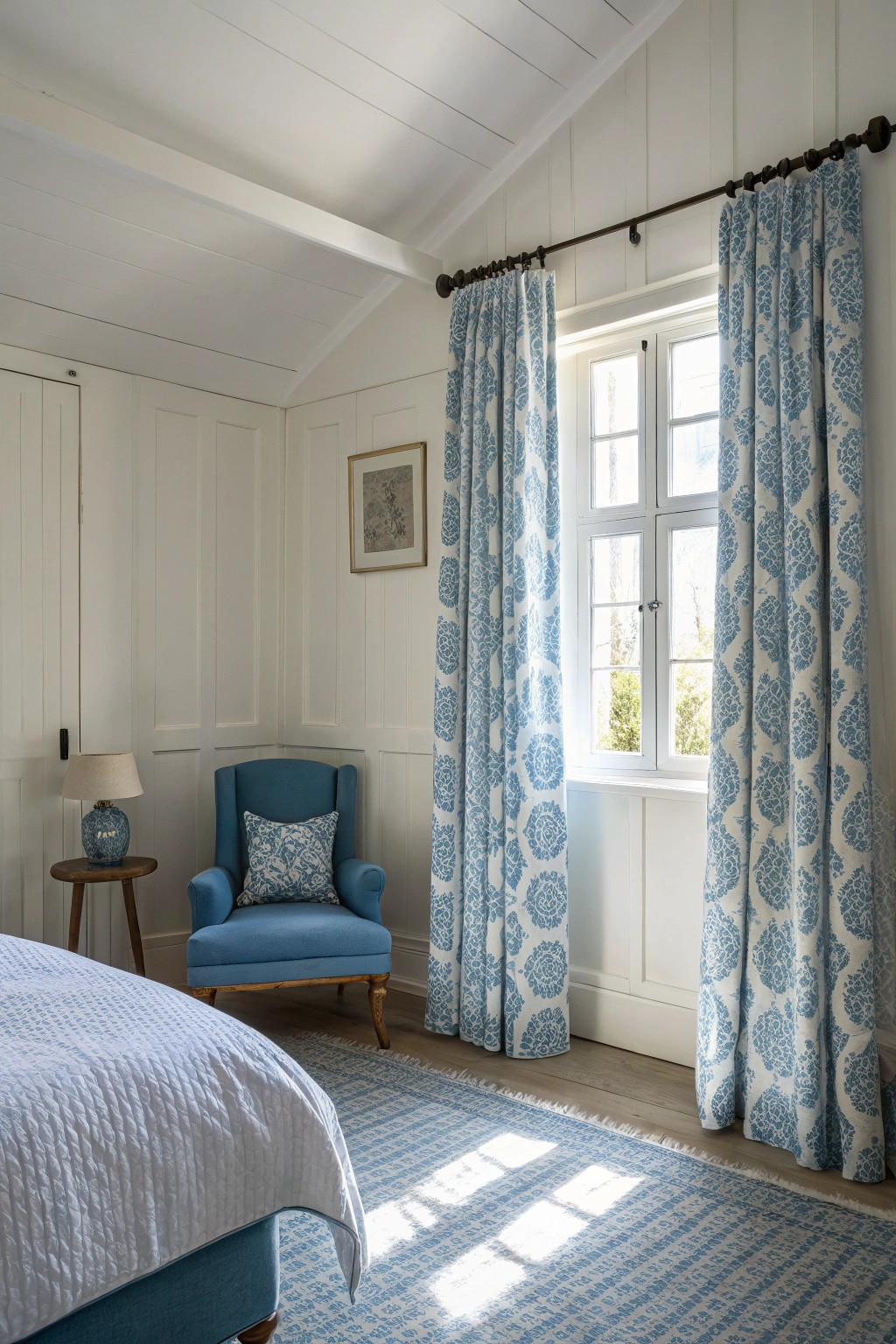 Blue window treatments provide softness and visual unity.