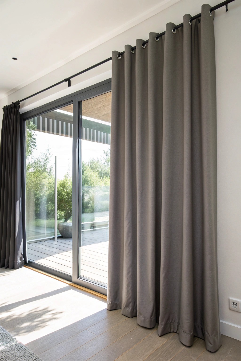 Sleek smoky gray grommet curtain—where effortless style meets smooth functionality.