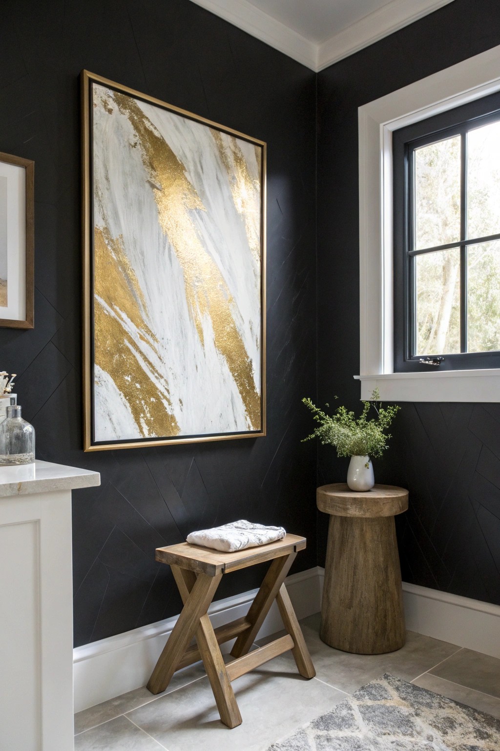 Let bold art shine against dramatic black walls for a gallery-inspired bathroom look.