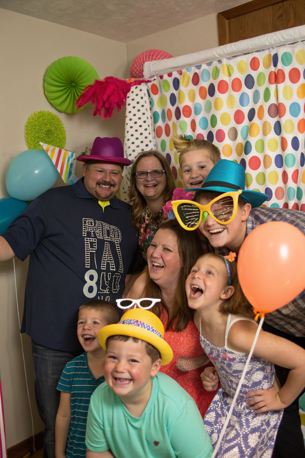 A playful DIY photo booth session full of laughter and fun props.
