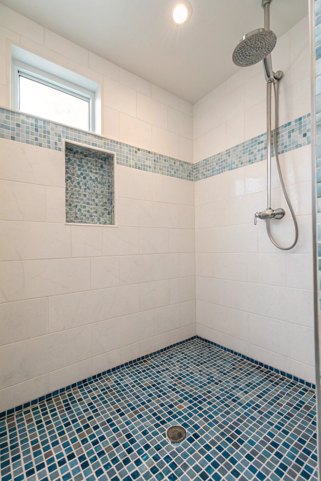 Blue tiles create a calming, water-inspired foundation.