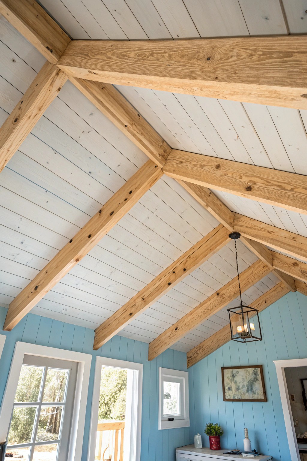 Make your she shed soar—add drama with a painted ceiling and statement wooden beams.