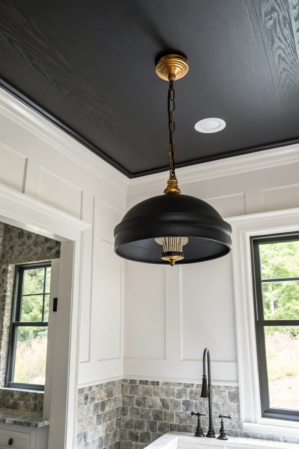 Elevate your bathroom with the unexpected drama of a black ceiling.