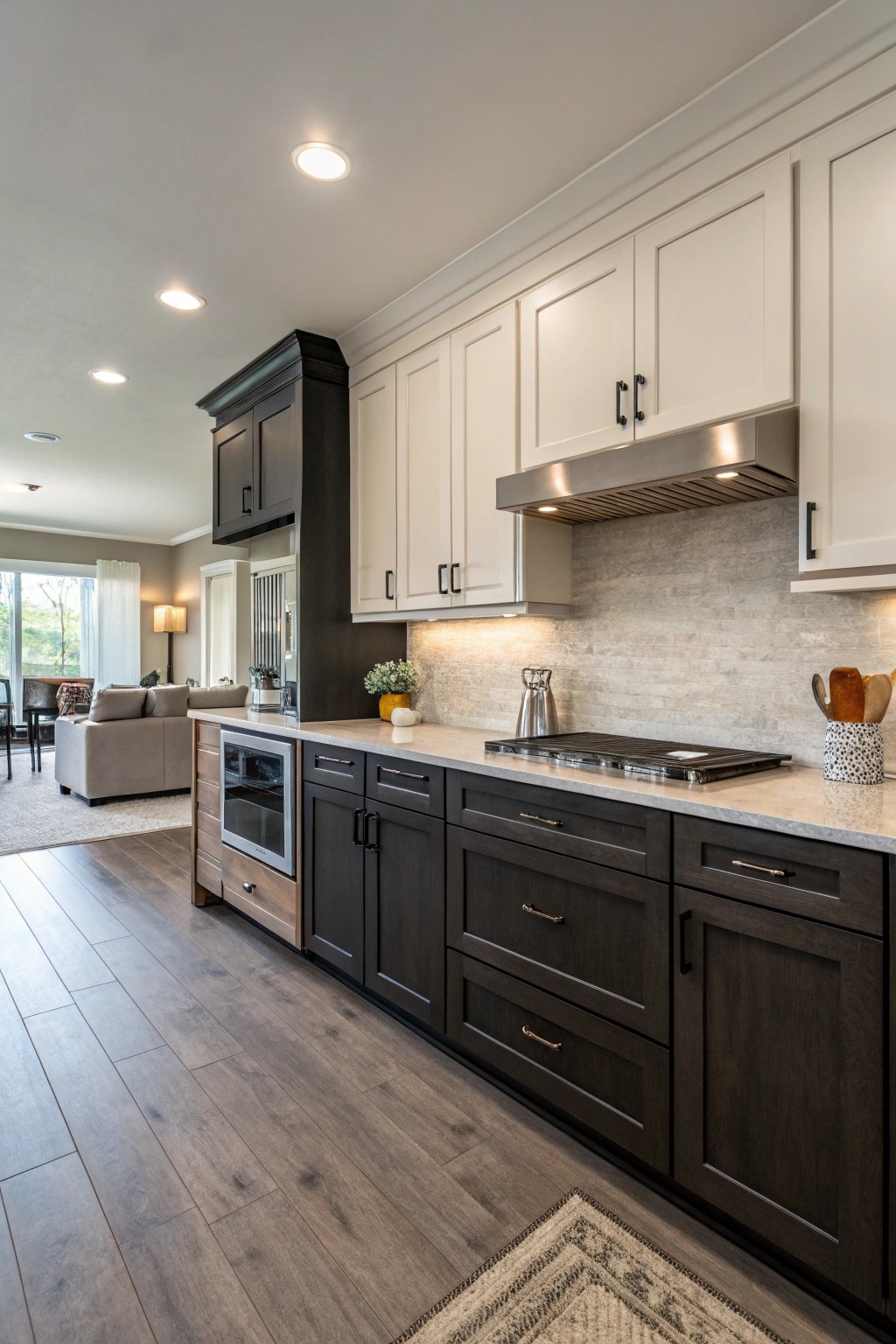 Two-toned cabinetry adds dimension and bold style to this open kitchen design.