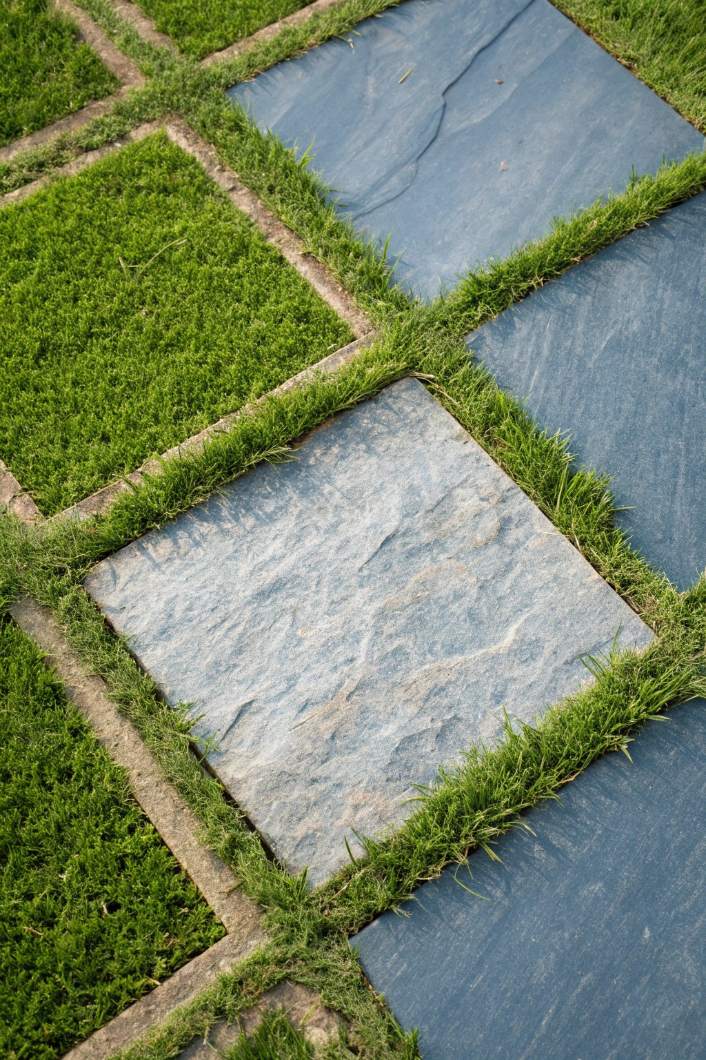 Modern magic: Bluestone and grass create an effortlessly chic patio statement.