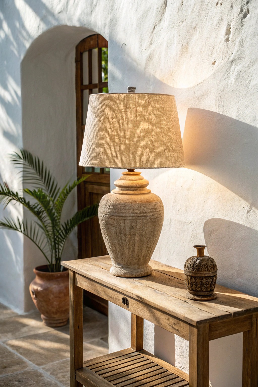 A handcrafted table lamp brings cozy warmth to your entryway.