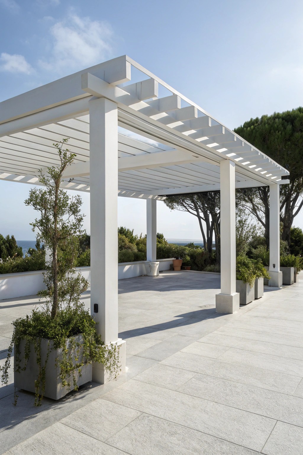 Elevate your patio with a minimalist white pergola—where modern simplicity meets serene outdoor living.