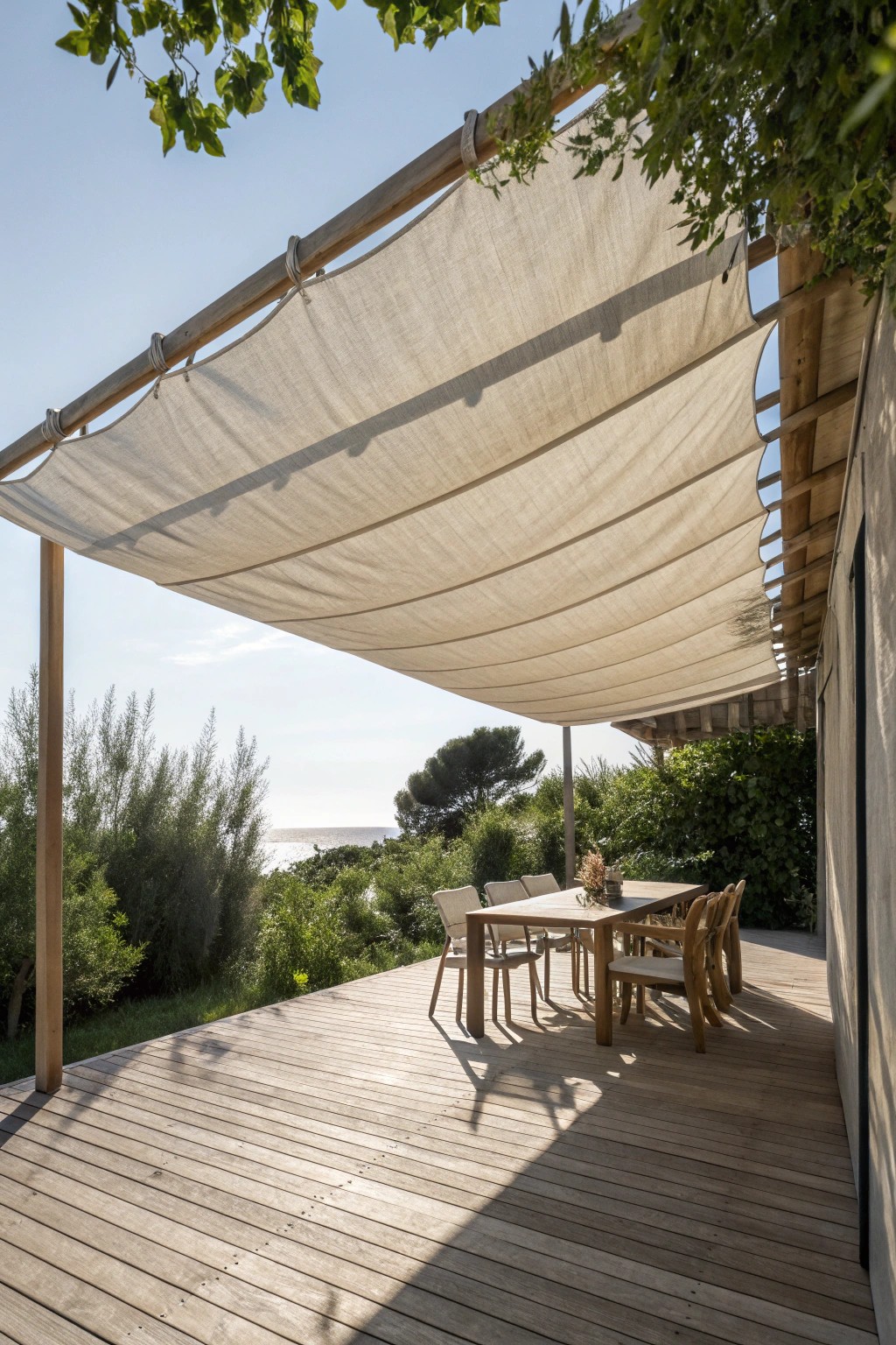 Effortless elegance: a retractable fabric canopy brings cozy shade and natural beauty to your deck.