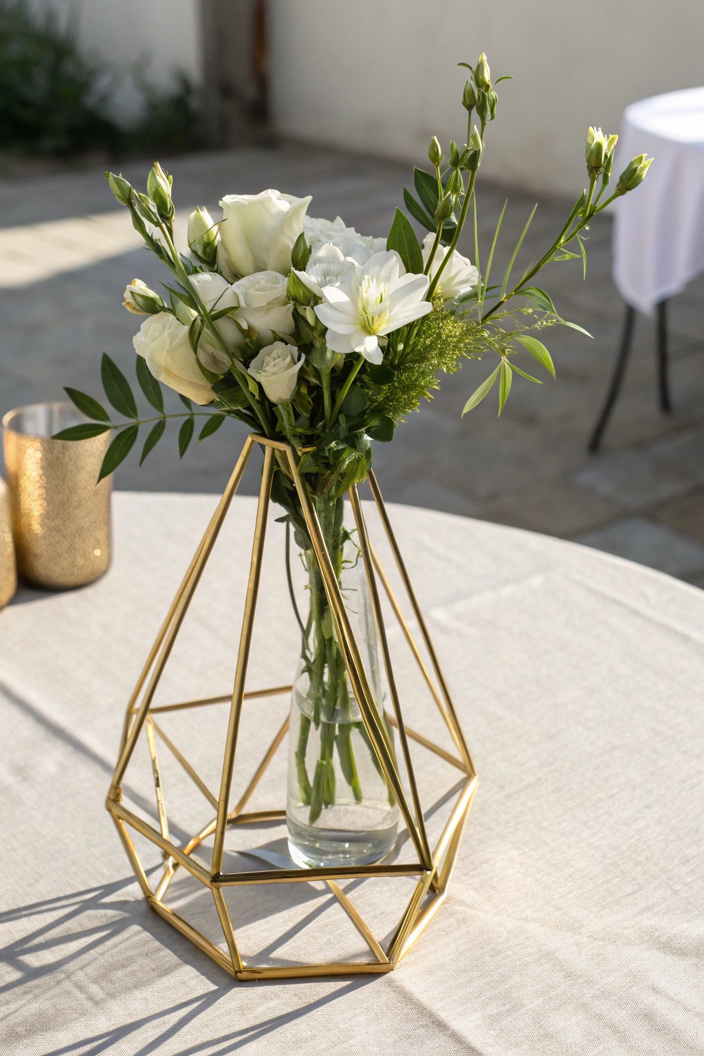 Sophisticated simplicity: a geometric gold vase, the perfect modern wedding centerpiece.