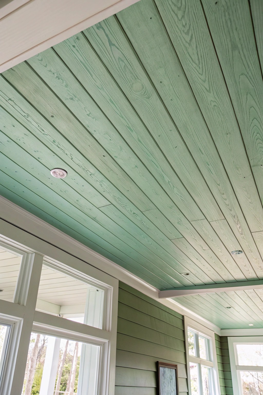 Bring calm and character to your space with a soft green shiplap drop ceiling.