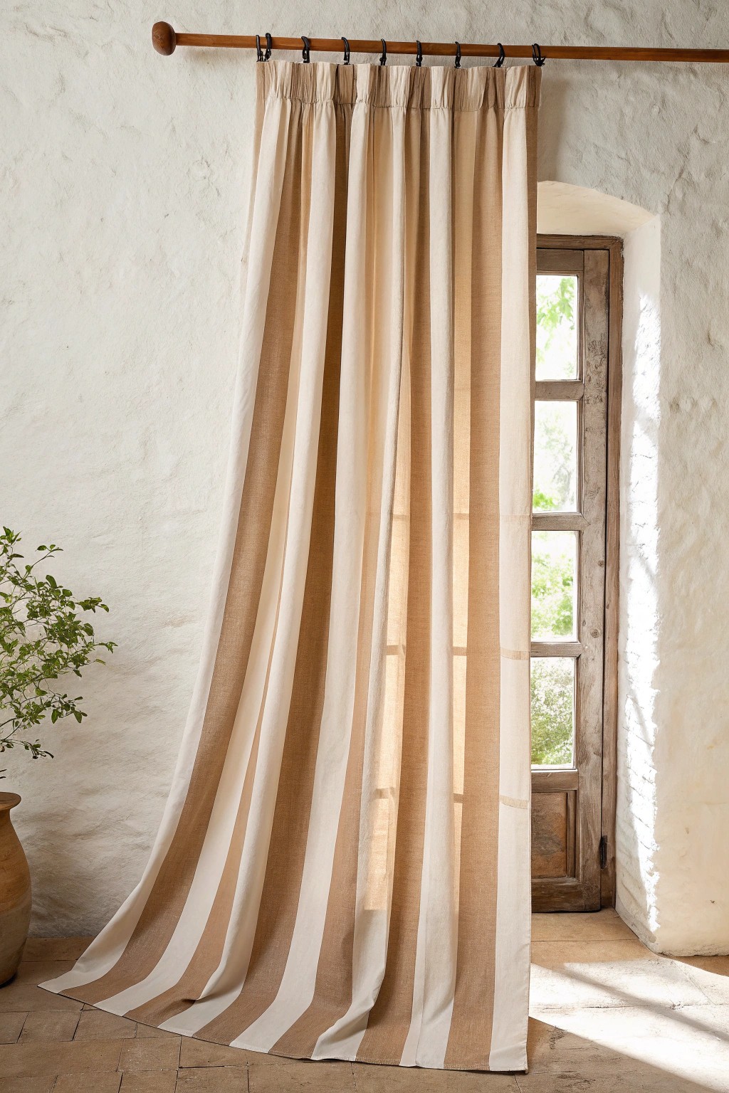 Elevate your living room with simple, striped curtains for effortless height and style.