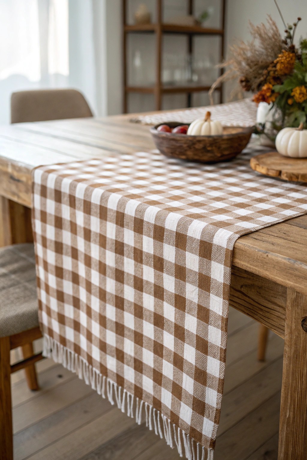 Classic charm: a brown-and-white gingham runner adds cozy elegance to your Thanksgiving table.