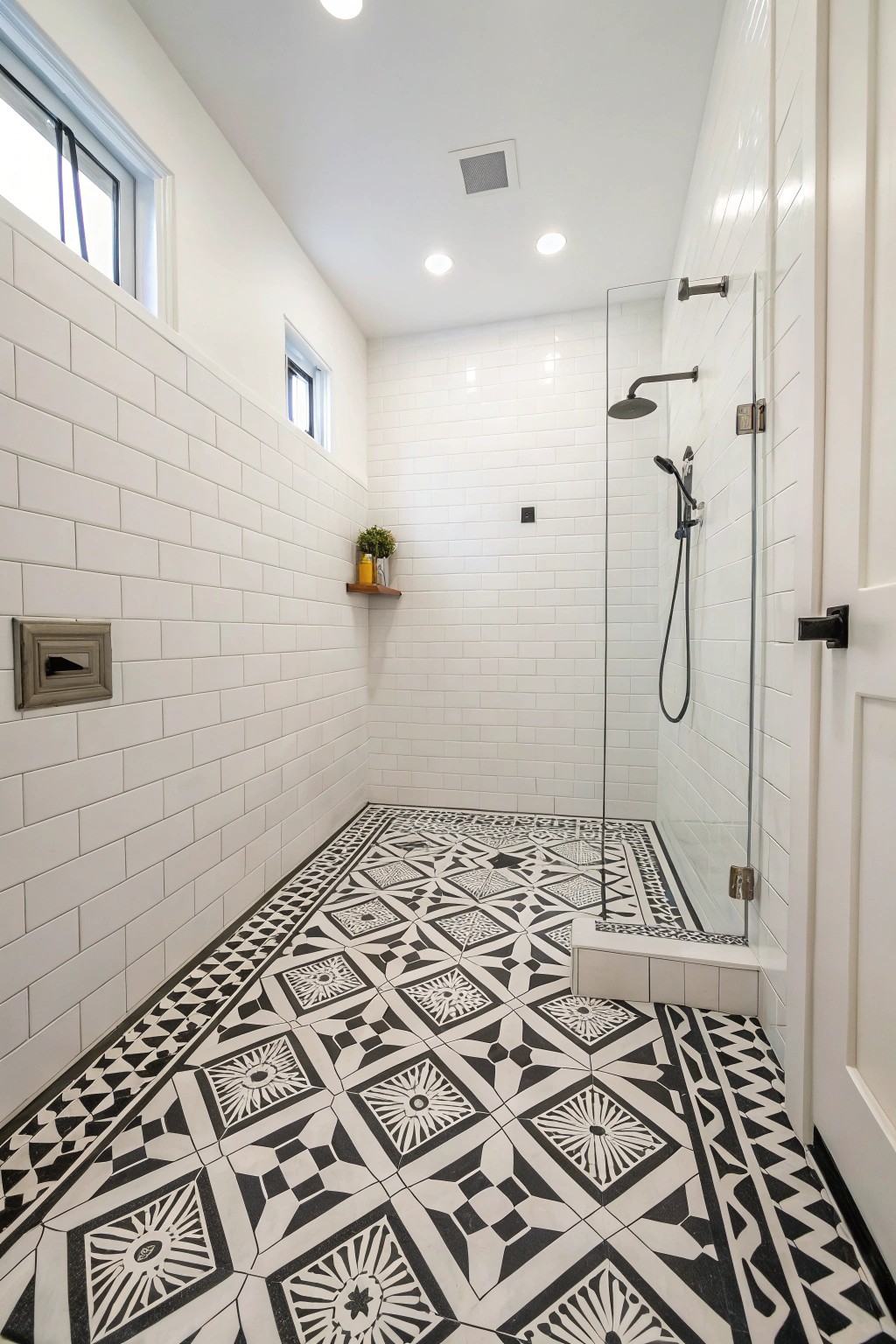 Dramatic patterned tiles add instant personality to the curbless shower.