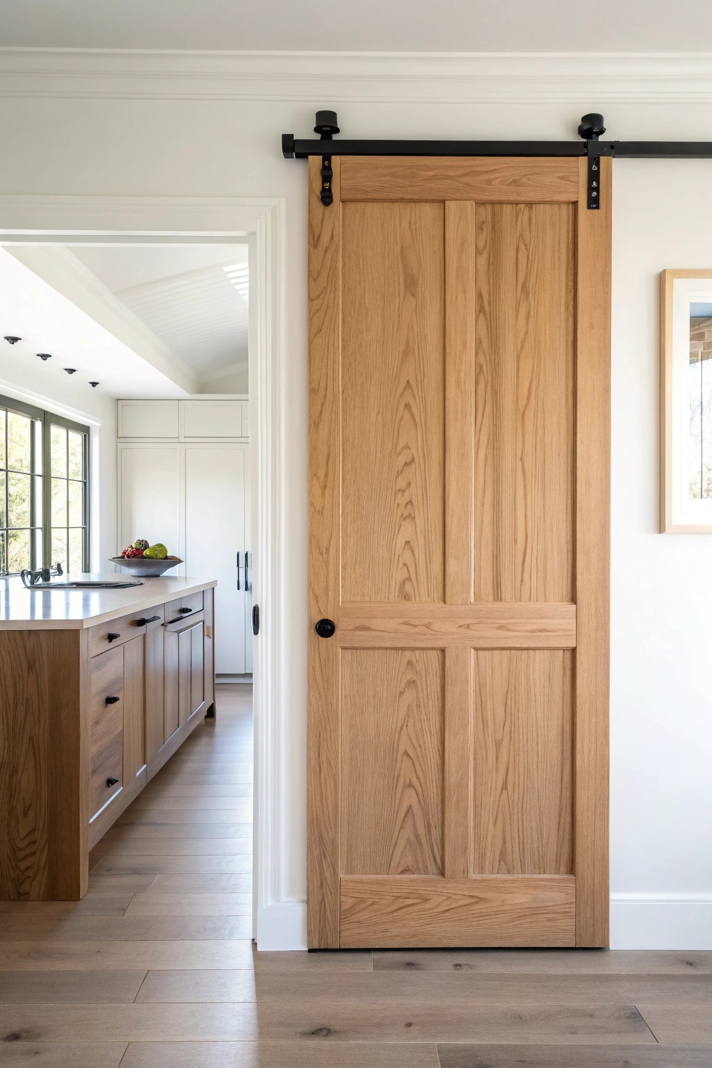Effortless elegance: a natural wood pocket door blends beauty with smart space-saving design.